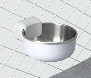  A stainless steel bowl attached to a crate 