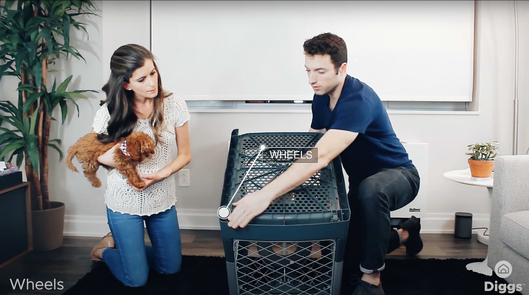  a man lifting a Revol crate next to a woman 