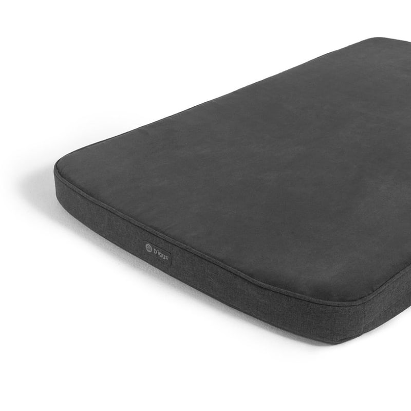 A dark grey Snooz Crate pad with the Diggs logo in front of the pad