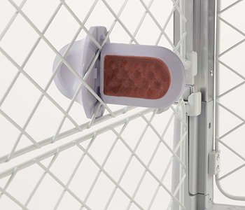  A Diggs Groov Training Aid in Lilac (light violet) that has a Diggs Treat Spread That's My Jam on it that is installed on a Revol mesh. 