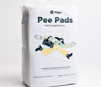  a bag of pee pads sitting on top of a white table 