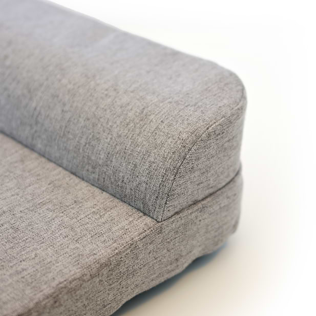 Close up of bolstered headrest on Bolstr dog bed with white background