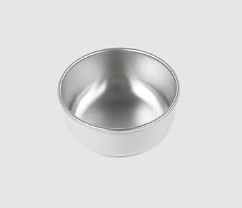  A white bowl sitting on white surface 