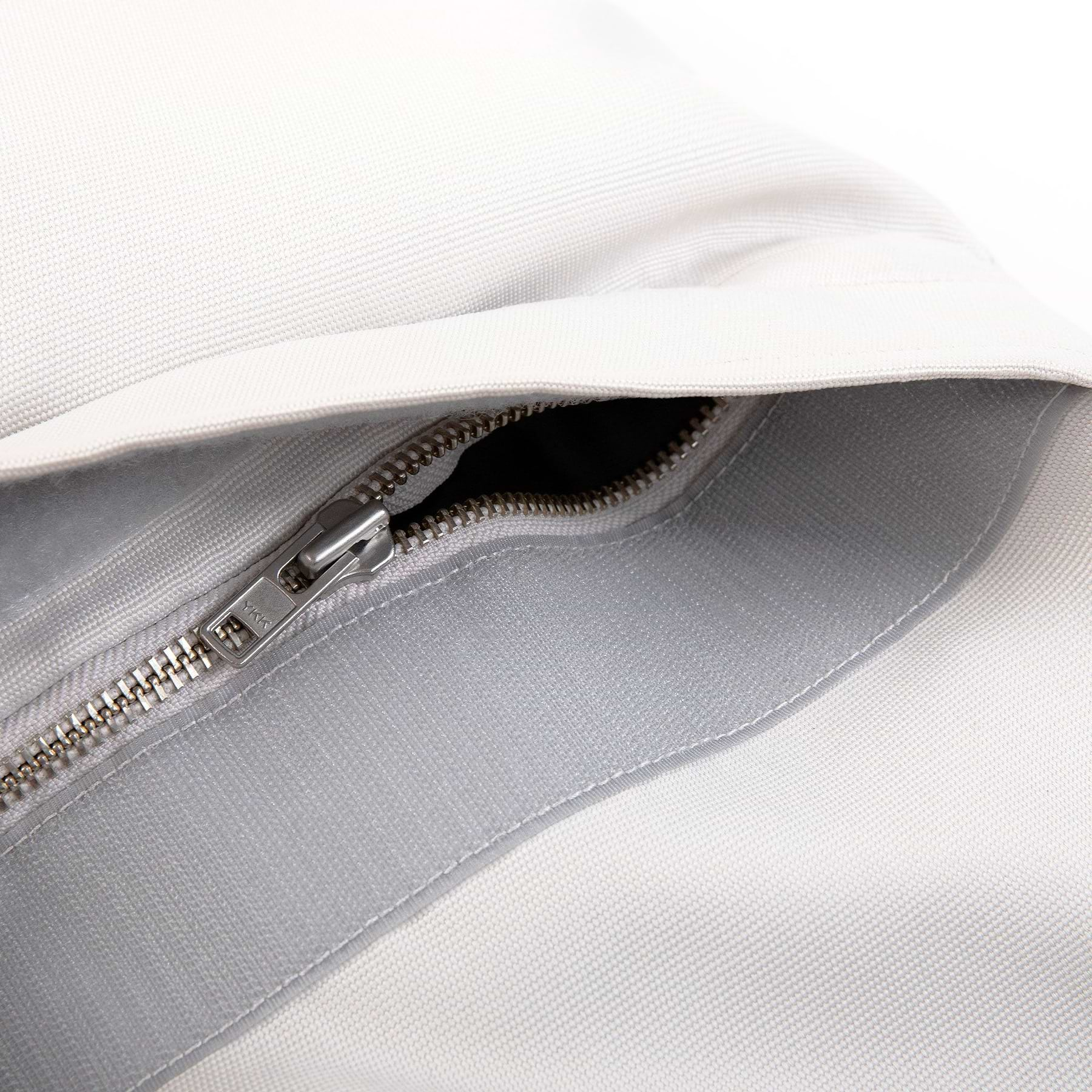  a close up of a zipper on a white Pillo 