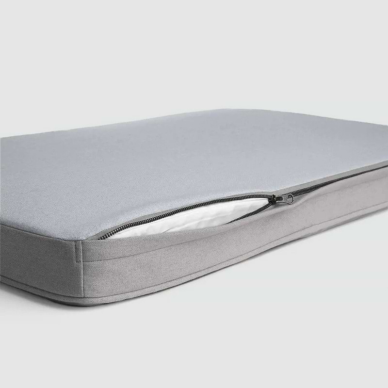 A close up of a dog bed on a white background 