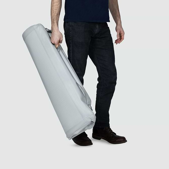  A man is carrying a deflated Enventur 