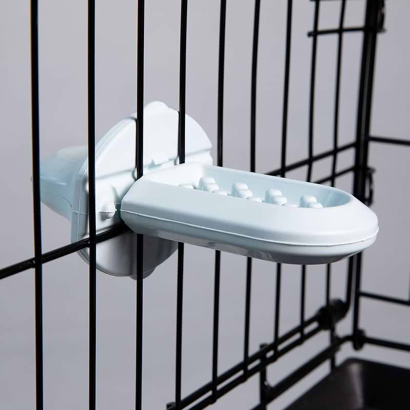  A close up of a Groov in a dog crate 