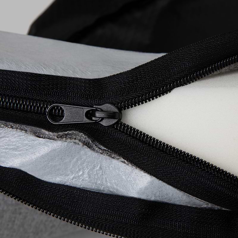 Close-up of zipper on Bolstr bed outer cover, showing memory foam inside