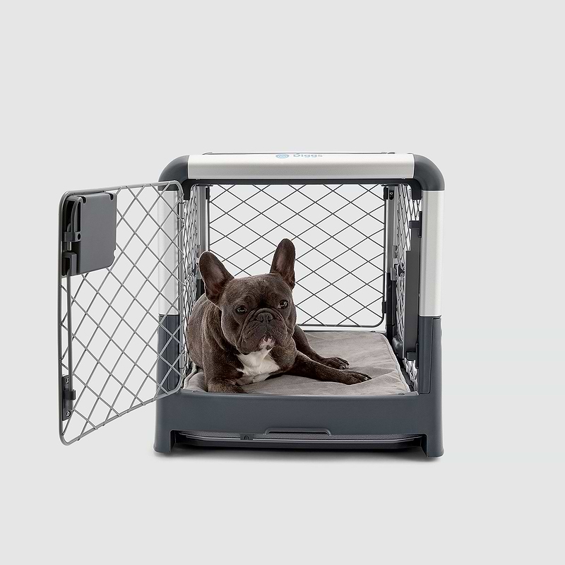 A dog laying in a dog crate