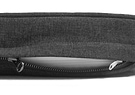 A Diggs snooz pad in dark Grey color with the zipper a bit opened, showing the white inner liner and white zipper of the snooz pad. 