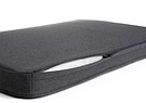 a close up of a dark grey Snooz with the outer cover partially unzipped