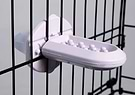 Groov Crate Training Aid in Lilac, attached to the mesh of a dog crate