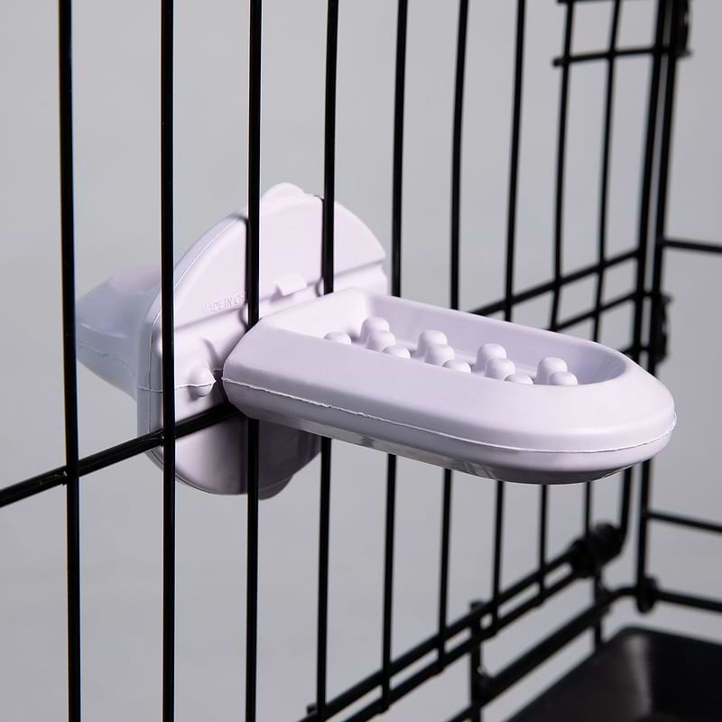 Groov Crate Training Aid in Lilac, attached to the mesh of a dog crate