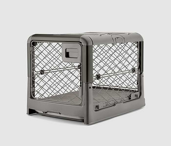  A Smoke Grey Revol Dog Crate pictured diagonally from the front on an offwhite background 