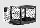 A black dog crate with a white background