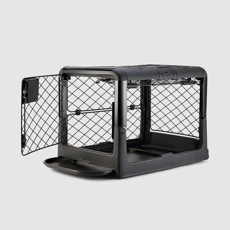 A black dog crate with a white background