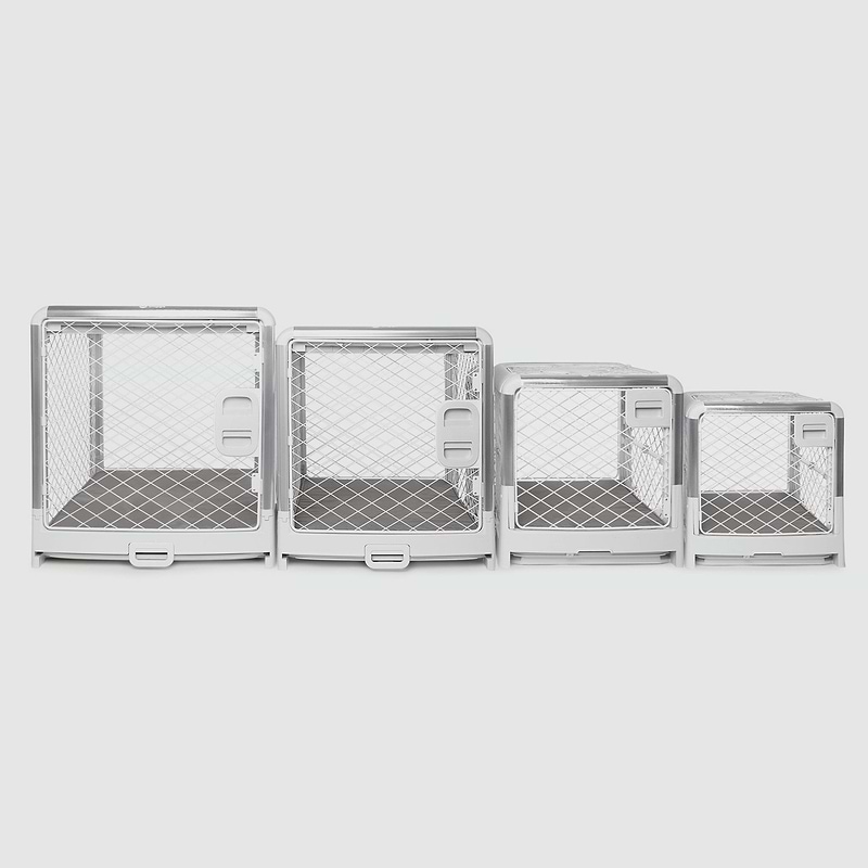 A set of four metal dog crates with doors