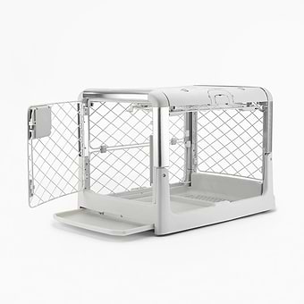 eafc275092fad6e17fad6c2252860725ccf13efd 2048x2048 A white dog crate its tray partially pulled out and open doors