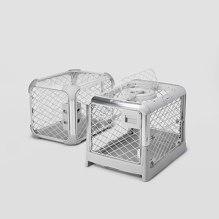 Evolv Revol Side A Revol and an Evolv dog crate sitting next to each other