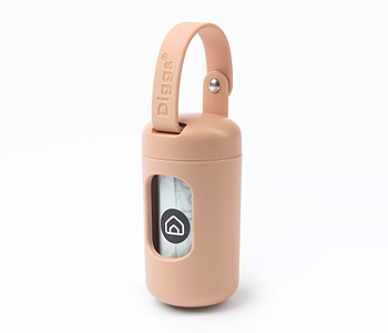  a close up of a blush poop bag dispenser on a white background 