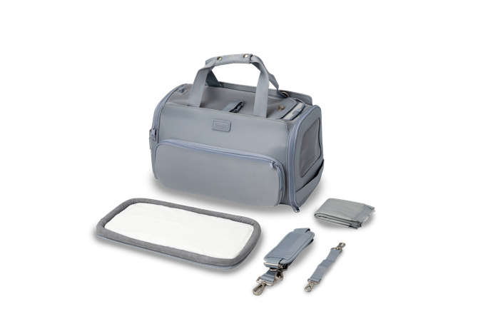 Passenger Overview A gray Passenger pet carrier bag with its included bed and other accessories