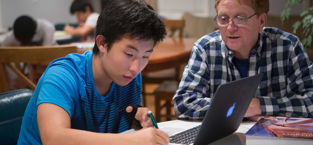 ABC scholar David Li gets some academic assistance from tutor Kevin Green. The ABC program provides tutors and both academic and extracurricular advisors to its scholars.