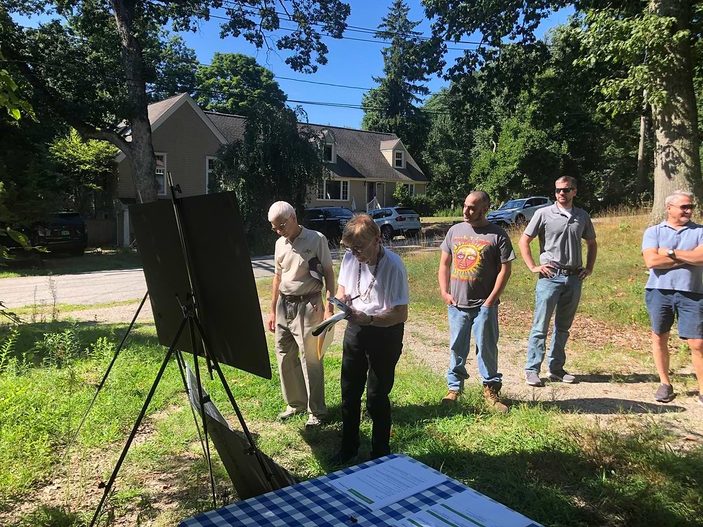 Carolanne Curry of Save Old Saugatuck takes notes at a presentation about the 157-unit apartment complex at the end of Hiawatha Lane Extension. / Photo by Thane Grauel.