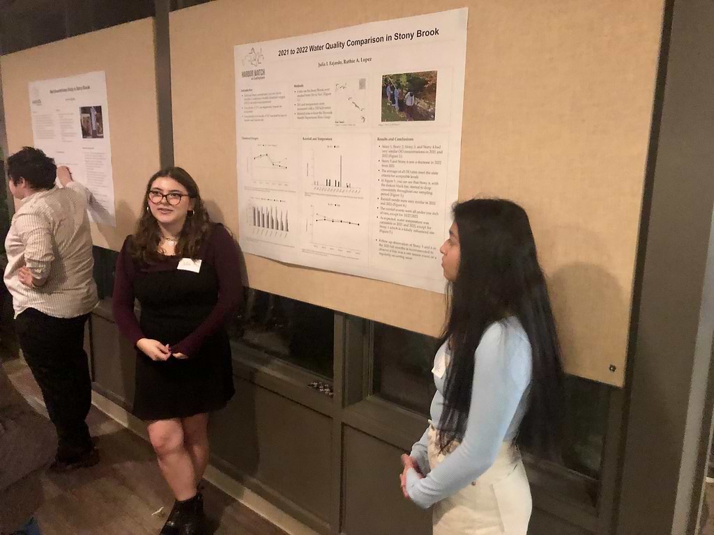 Julia I. Fajardo, left, a junior at Fairfield Warde High School, and Ruthie A. Lopez, a sophomore at Stratford High School, present their water quality findings. / Photo by Thane Grauel