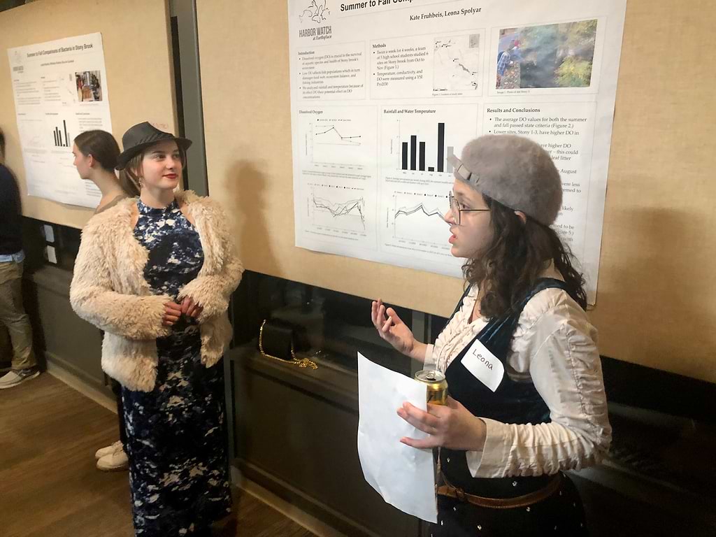 Kate Fruhbeis, left, from Weston High, and Leona Spolyar of Fairfield Warde, present their findings on dissolved oxygen in Stony Brook. / Photo by Thane Grauel