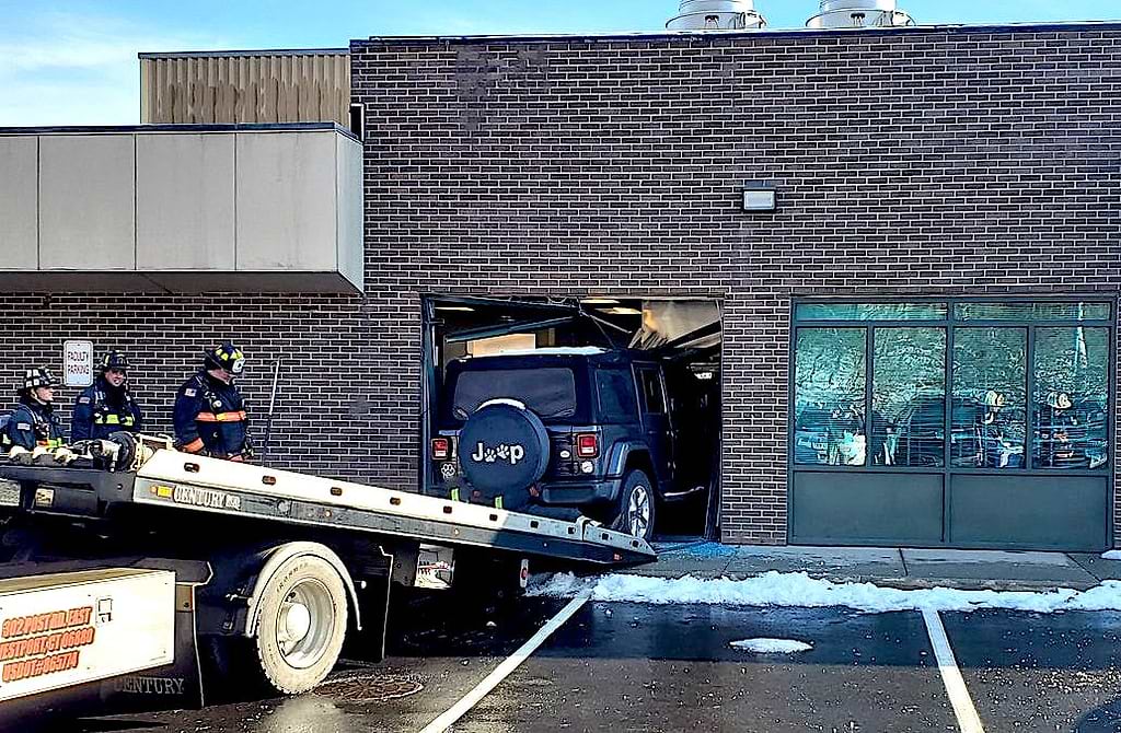 Aftermath Staples kitchen in disarray after Jeep breaches wall