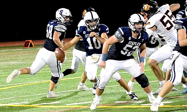 Wreckers whip Wilton in soggy gridiron clash