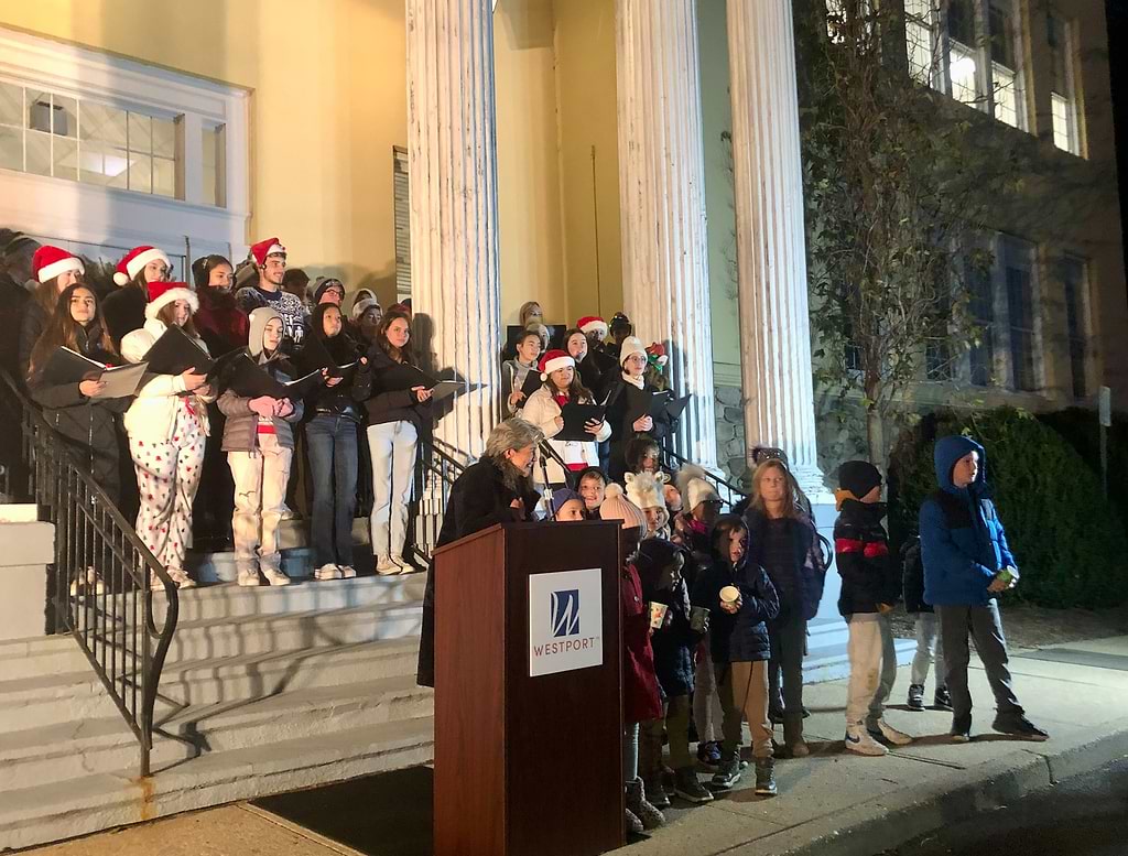 First Selectwoman Jennifer Tooker called children up to help count down to the lighting of the town's Christmas tree on Thursday. / Photo by Thane Grauel