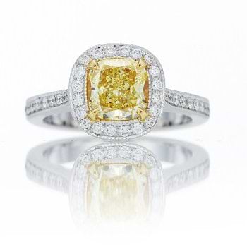 A 1.08 carat Fancy Yellow radiant halo semi-eternity diamond ring