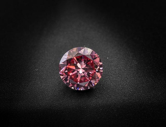 A 0.70 carat, Fancy Vivid Pink Diamond, Round Shape, SI1 Clarity, GIA 