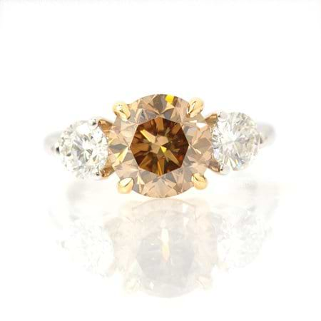 2.07 Carat, Fancy Yellowish Brown three stone diamond ring, Round, VS2