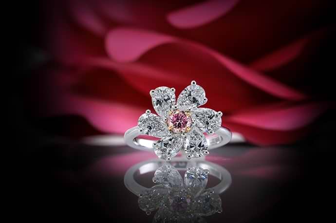 A 2.86 carat (TW) fancy intense purplish pink diamond ring in a floral design 