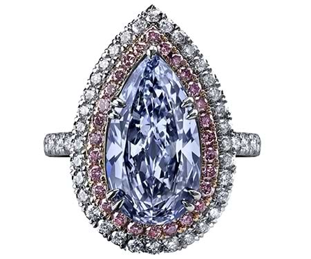 A 4.47 carat, fancy-blue, pear-shaped diamond ring