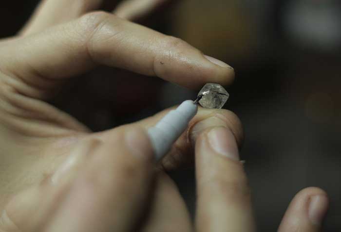 Marking the stone in preparation for cutting