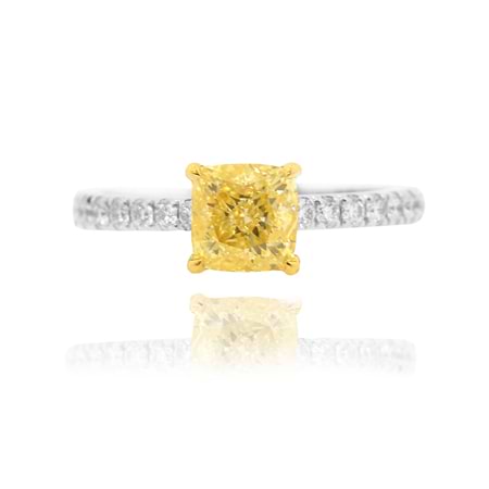 fancy light yellow cushion diamond ring with side diamonds