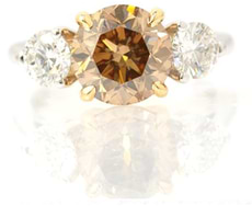 Round Fancy Yellowish Brown and Colorless Three Stone Ring