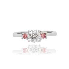 Pink and white round shape classic 3 stone engagement ring