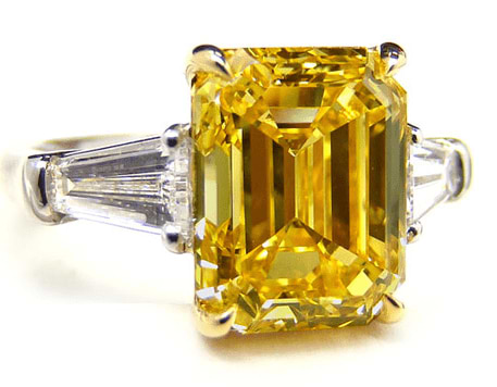 5.91 Fancy Intense Yellow Emerald Cut Diamond Ring with 0.90 ct Baguette Side Stones
