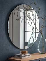 Cherington Mirror - 100cm hanging on a blue painted wall