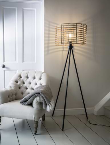 Narrow tripod store floor lamp