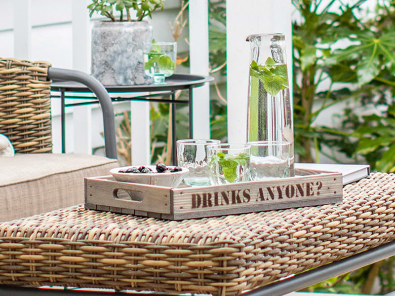 Drinks Tray laid with glassware and ceramic bowl with blueberries