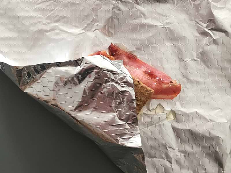 Smores being wrapped in foil to create a parcel