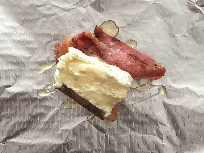 Maple syrup drizzled on camembert and bacon