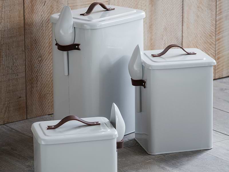 Group of Pet Food Bins against wooden background