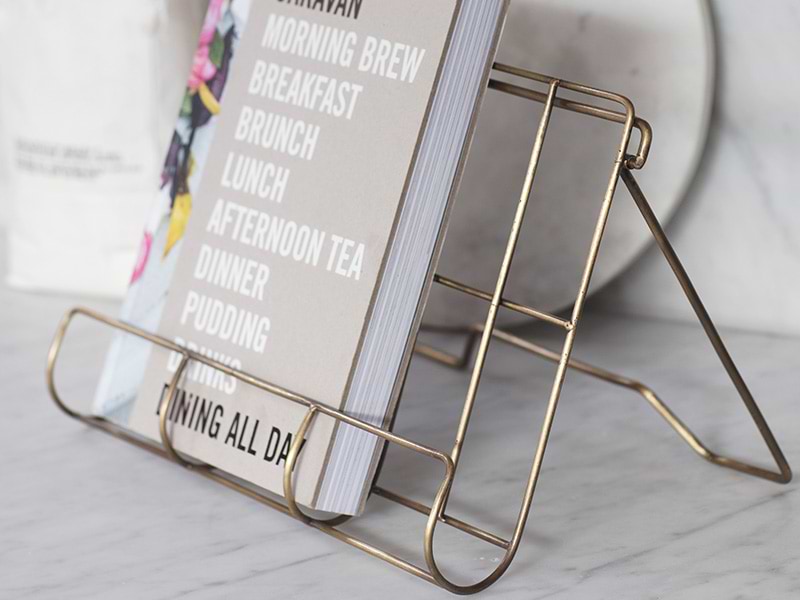 Brompton Antique Brass Finish Cook Book Holder with cook book on kitchen counter