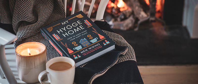 A copy of "My Hygge Home" by Meik Wiking on  chair